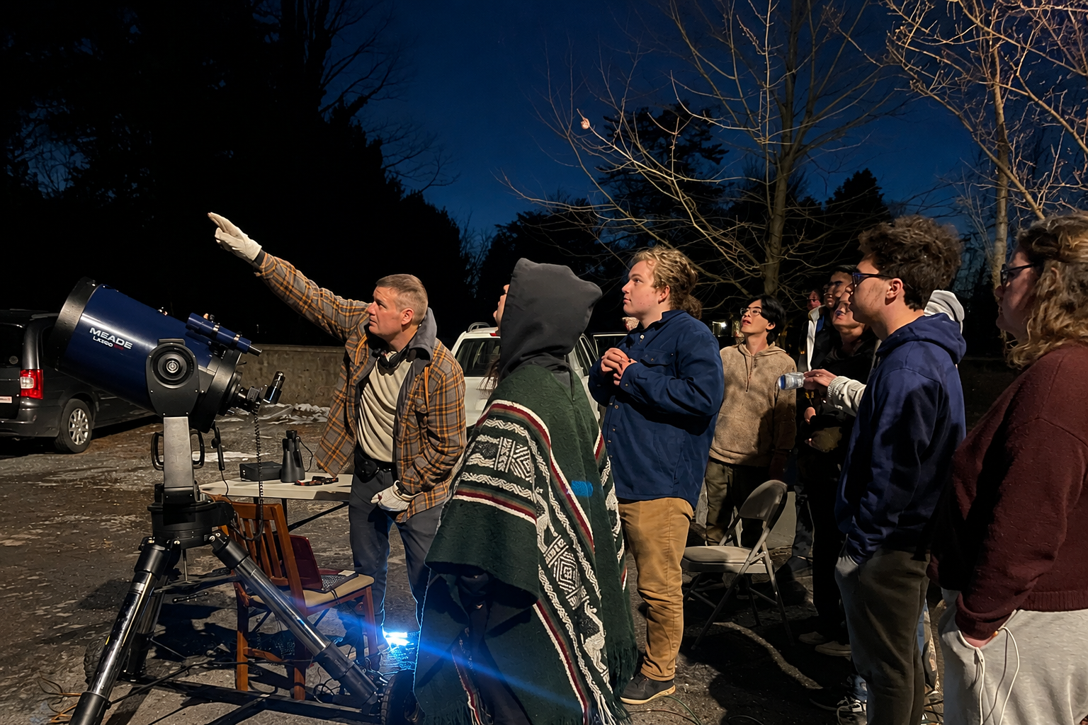 BLC students gathered around a telescope during a night-sky observation